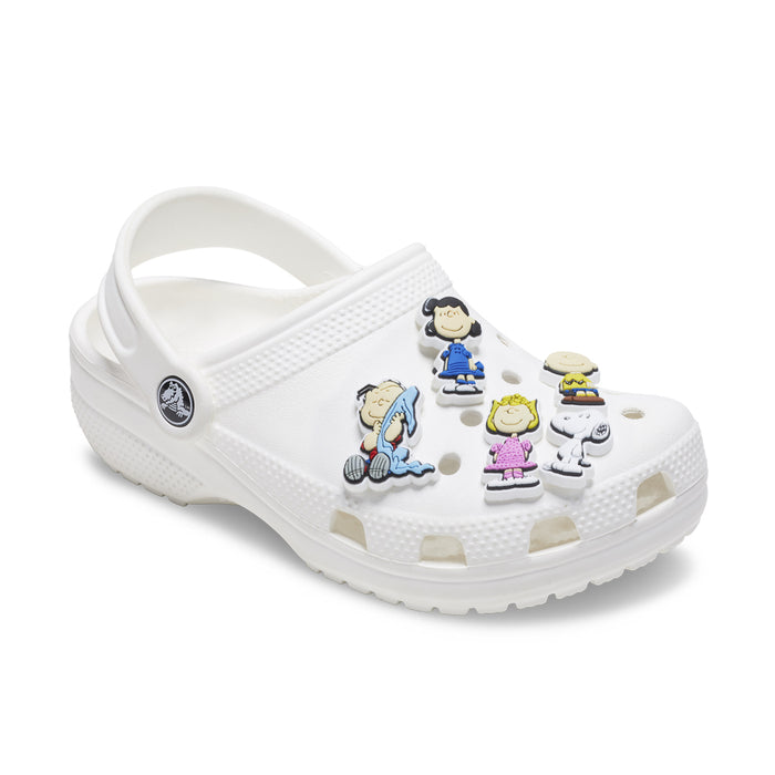 White Crocs-style clog with five Peanuts Jibbitz charms, Snoopy and Charlie Brown