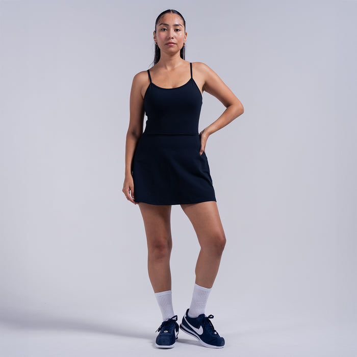 Black A-line skater dress with spaghetti straps and fitted waist seam