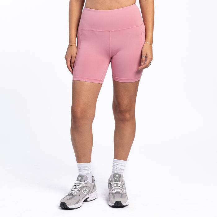Women’s rose pink bike shorts, fitted mid-thigh length with side seams