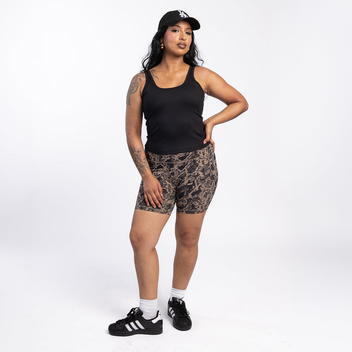 Women’s snake-print bike shorts worn with a black tank top