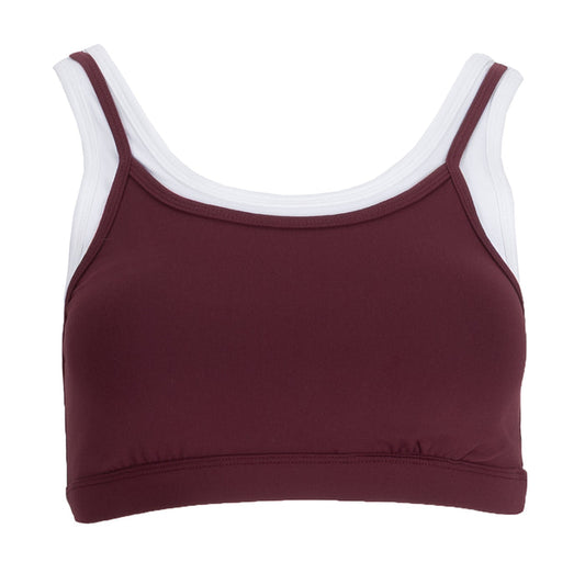 Women's layered sports bra in burgundy with white trim and racerback straps