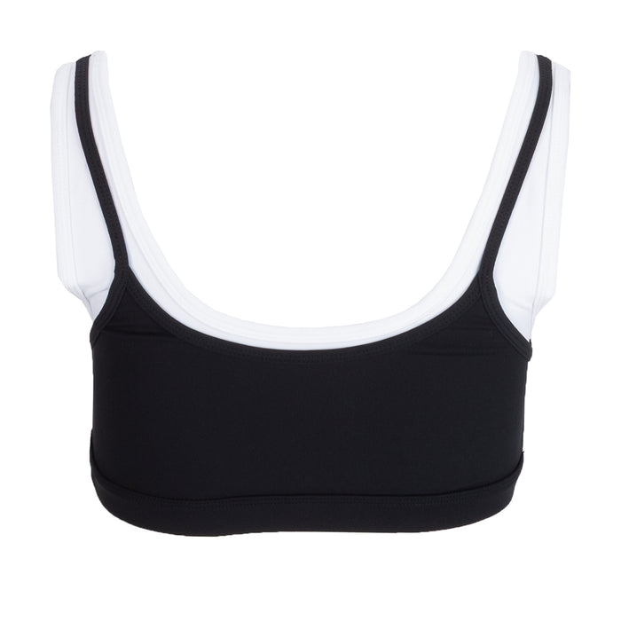 Women's black sports bra with wide straps and contrast white binding; layered look