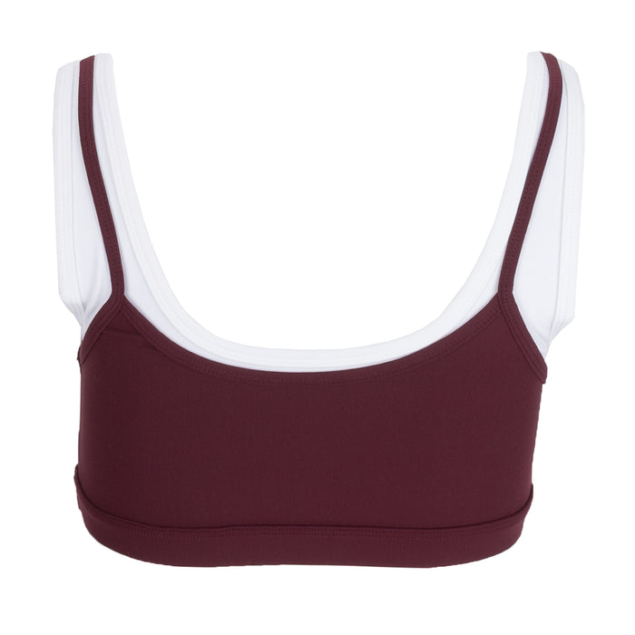 Women's layered sports bra in burgundy with wide U-neck and white-trim straps