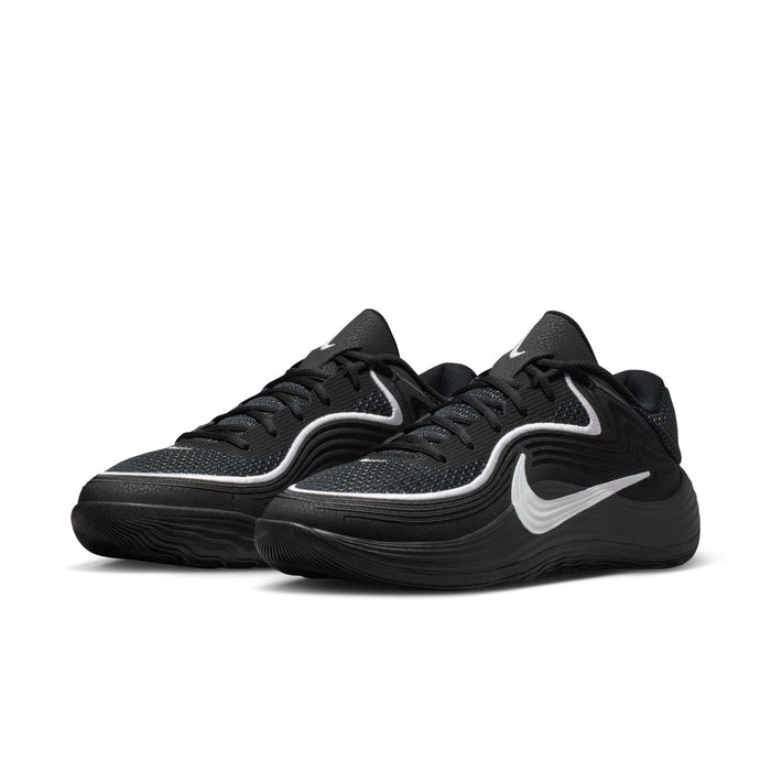 Men's black low-top sneakers, side view with white swoosh and textured sole