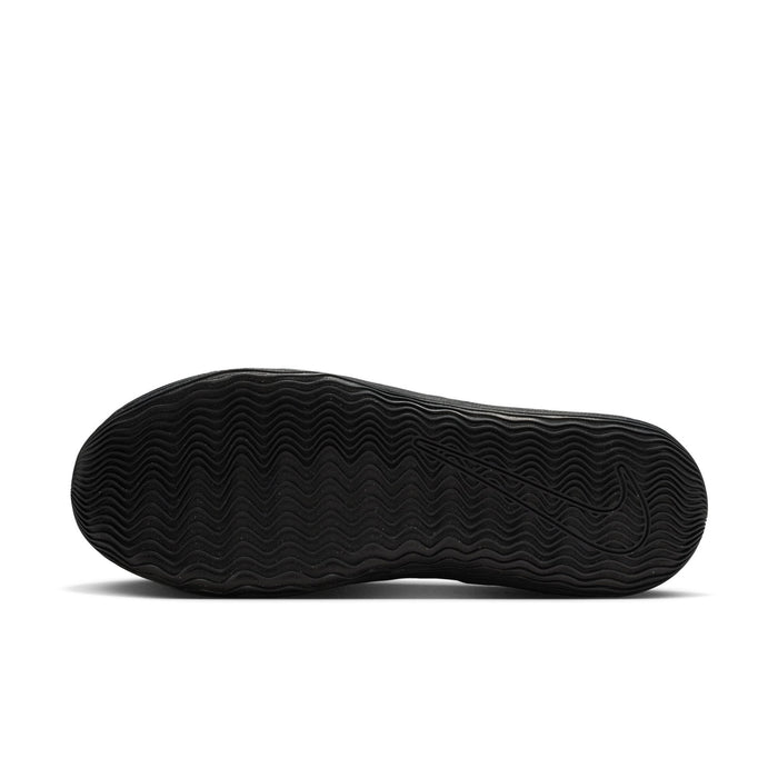 Men's black outsole tread on low-top sneakers, textured rubber bottom