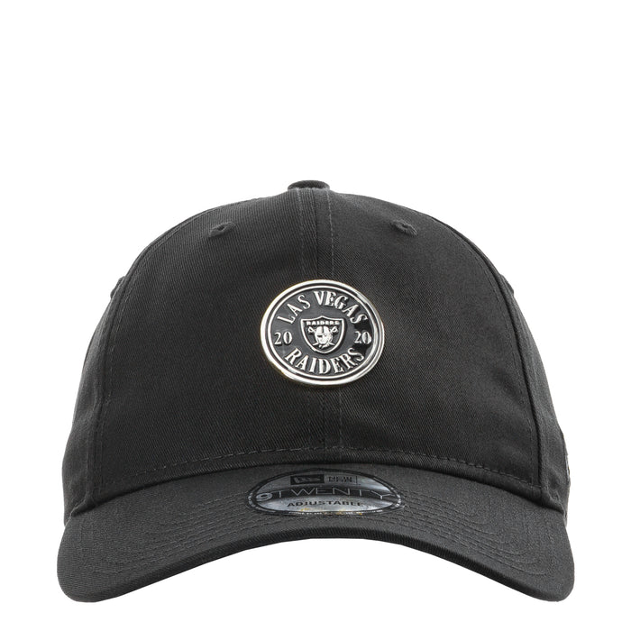 Black baseball cap with circular Raiders logo patch on the front, curved brim