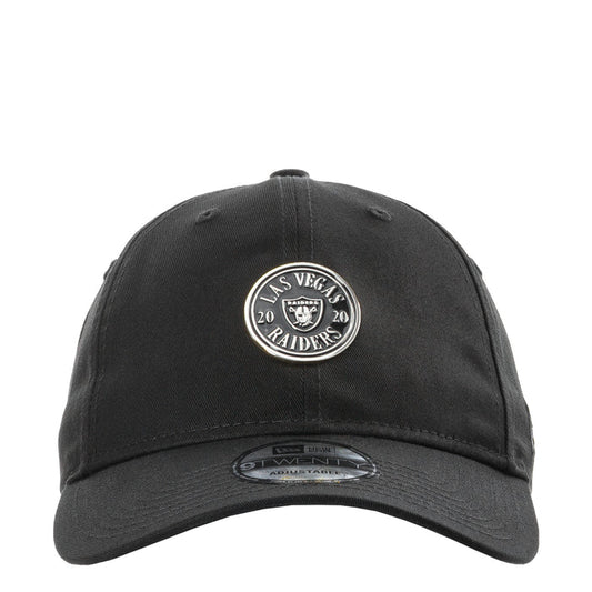 Black baseball cap with circular Raiders logo patch on the front, curved brim
