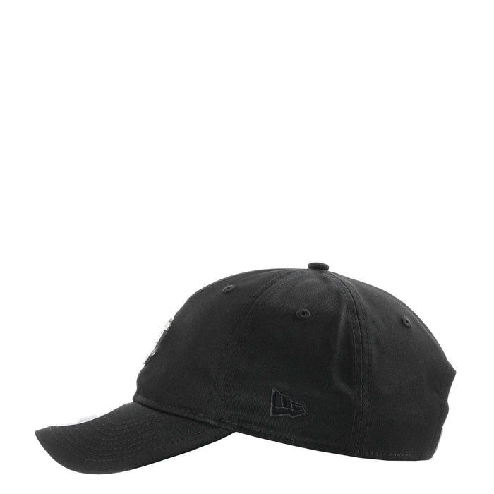 Black baseball cap with small stitched flag emblem on the front panel