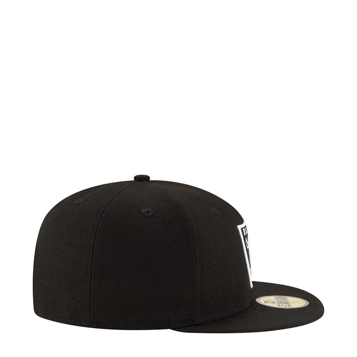 Black snapback cap with white side logo patch and curved brim