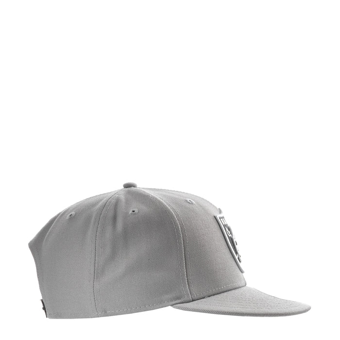 Grey baseball cap viewed from the side with a New Era flag patch