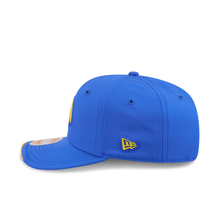 Blue cap with New Era logo on side and curved yellow-trim brim