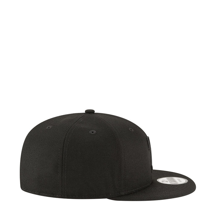 Black baseball cap side view with stitched eyelets and adjustable back strap