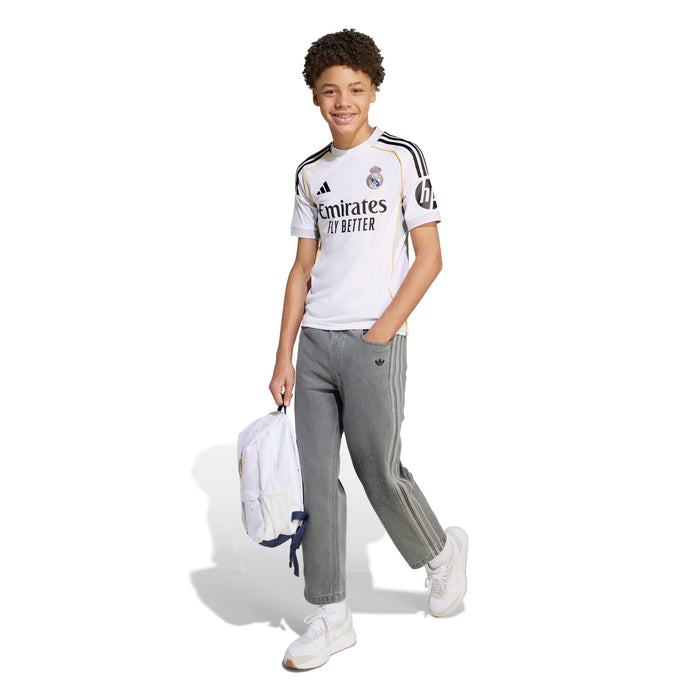 Youth Real Madrid home replica jersey, white with black-and-gold trim and Emirates logo