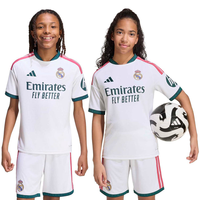 Youth Real Madrid home soccer kit: white jersey with pink stripes, teal trim, and team crest