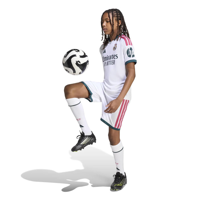 Youth Real Madrid home jersey and shorts set in white with pink stripes and teal trim
