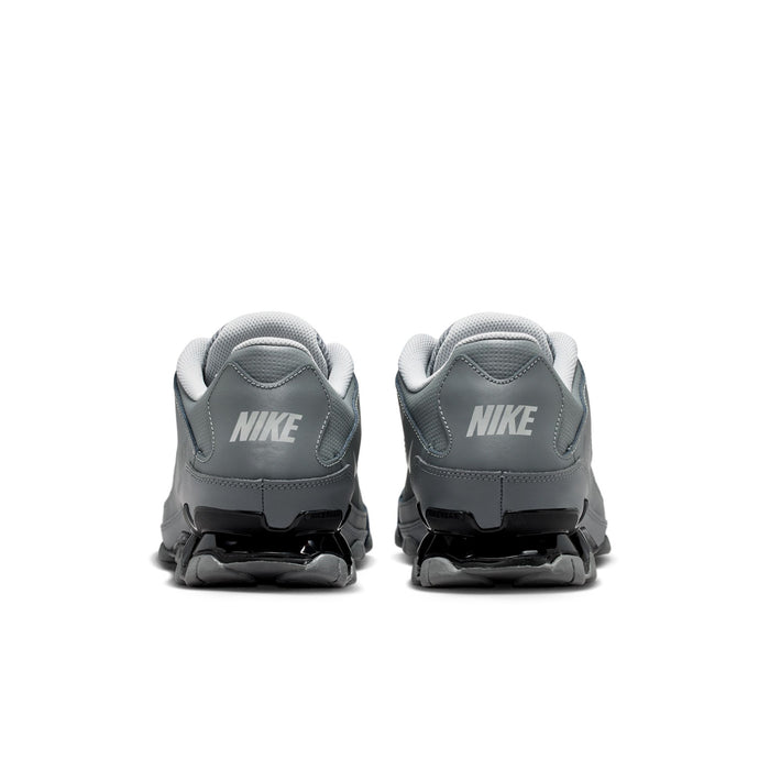 Men's training shoes heel view in smoke grey with black midsole accents and rear cushioning.
