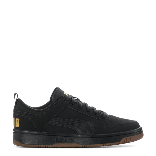 Black youth low-top sneaker, lace-up, gum-brown outsole, gold logo detail