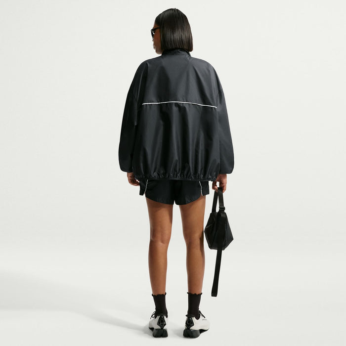 Women's black windbreaker jacket rear view with full back and zip front piping