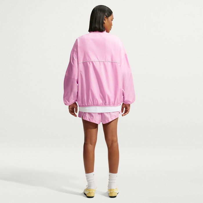 Women's pink windbreaker jacket from back with elastic cuffs and hem