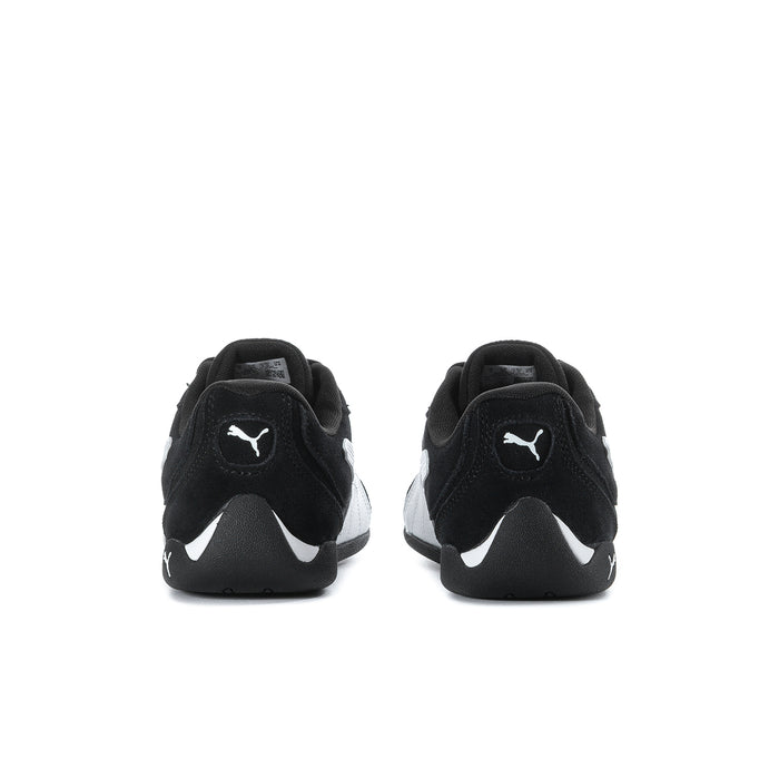 Women's black low-top sneakers with PUMA logo at back, heel view