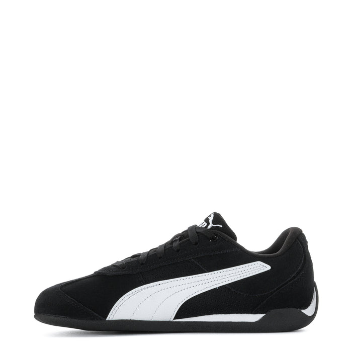Youth black Puma suede sneakers, side view with white center stripe