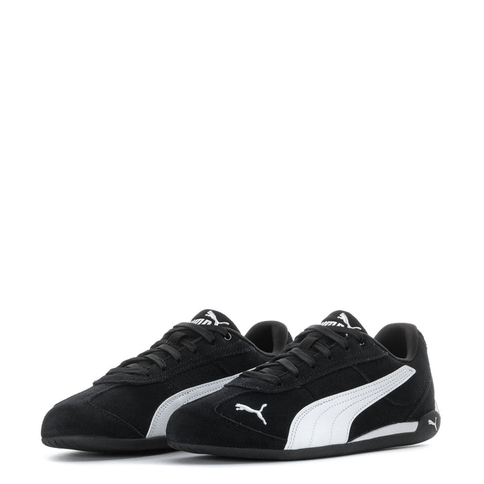 Youth black Puma suede sneakers pair view with white stripes and Puma logos