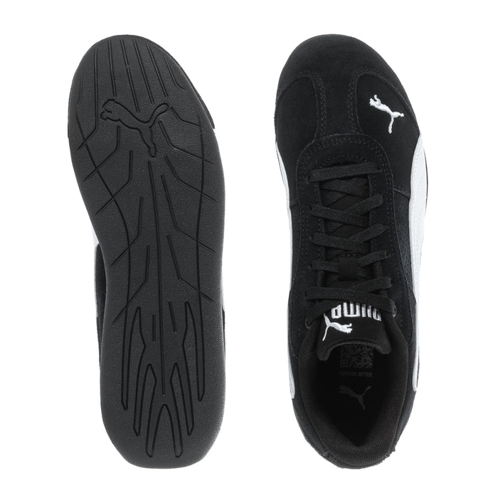 Youth black sneakers outsole and side profile, textured tread and Puma logo