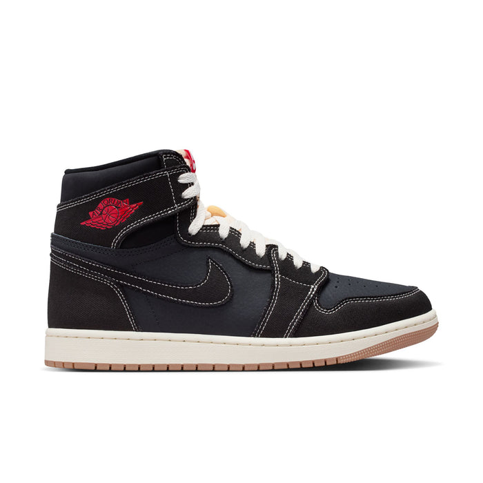 Black high-top sneakers with white sole, red accents, and lace-up design