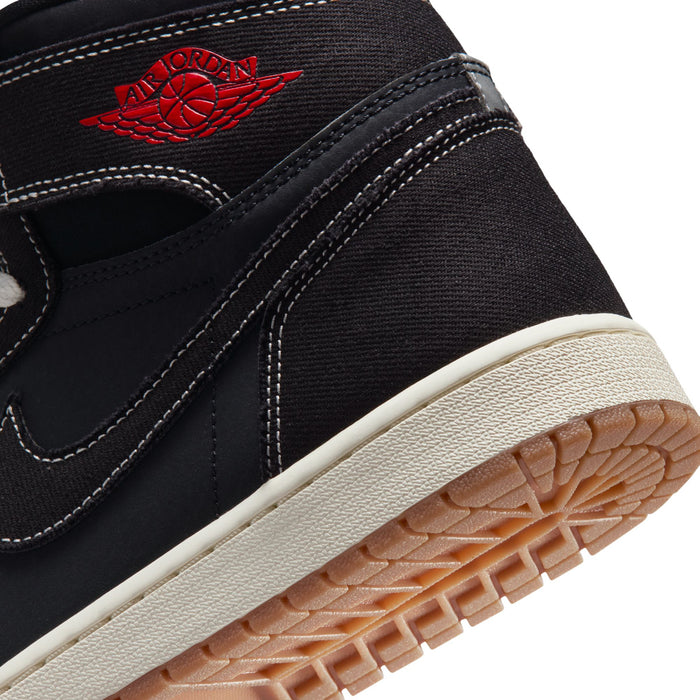Black high-top sneakers close-up with red Jordan logo and textured gum outsole edge