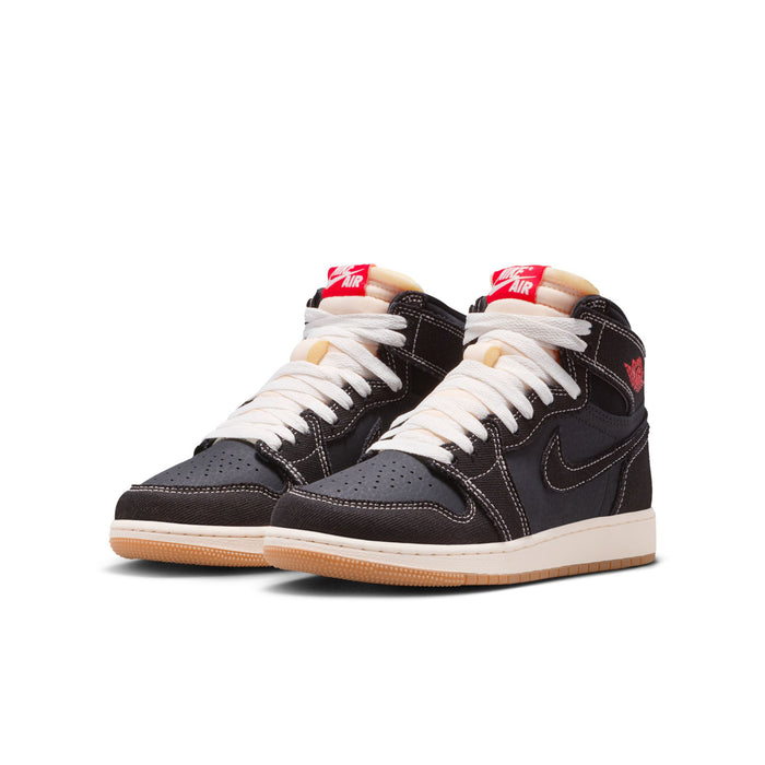 Pair of black youth high-top sneakers with white laces, red heel accents, gum sole.
