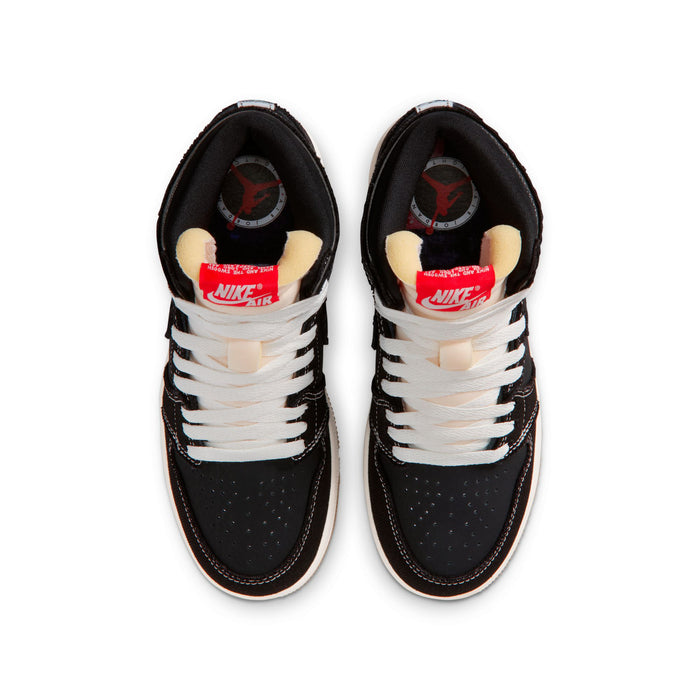 Black youth high-top sneakers showing white laces and Nike Air tongue lining.