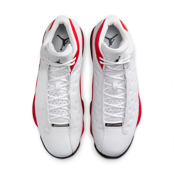 White high-top sneakers with red accents, black trim, and lace-up front view