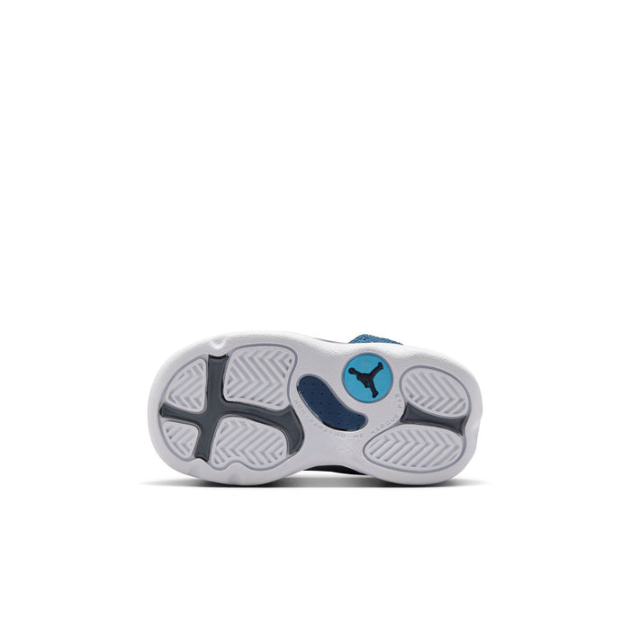 Toddler sneaker outsole view with tread and blue Jordan logo details