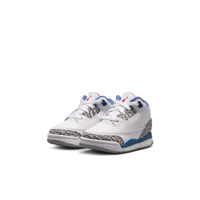 Toddler retro sneakers, white upper with blue swoosh, gray speckled detail, and red heel accents