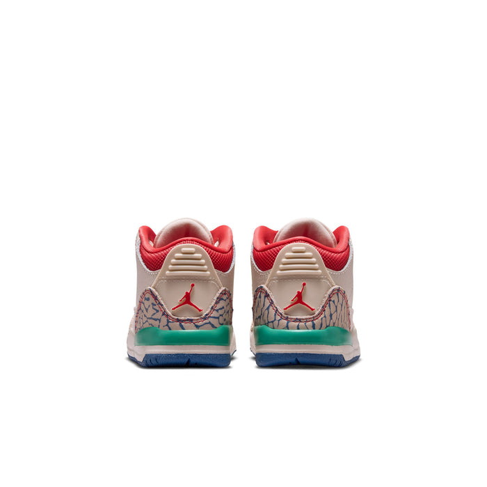 Toddler sneaker back view with red heel tabs, embossed wing logo, and teal midsole