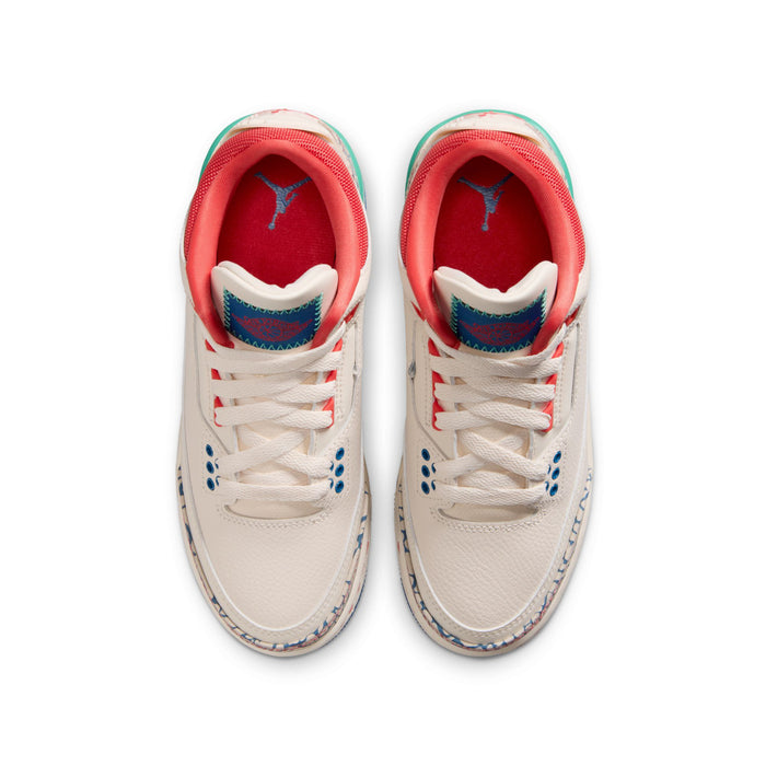 Youth sneaker pair front view with white laces, red interior, and patterned side panels