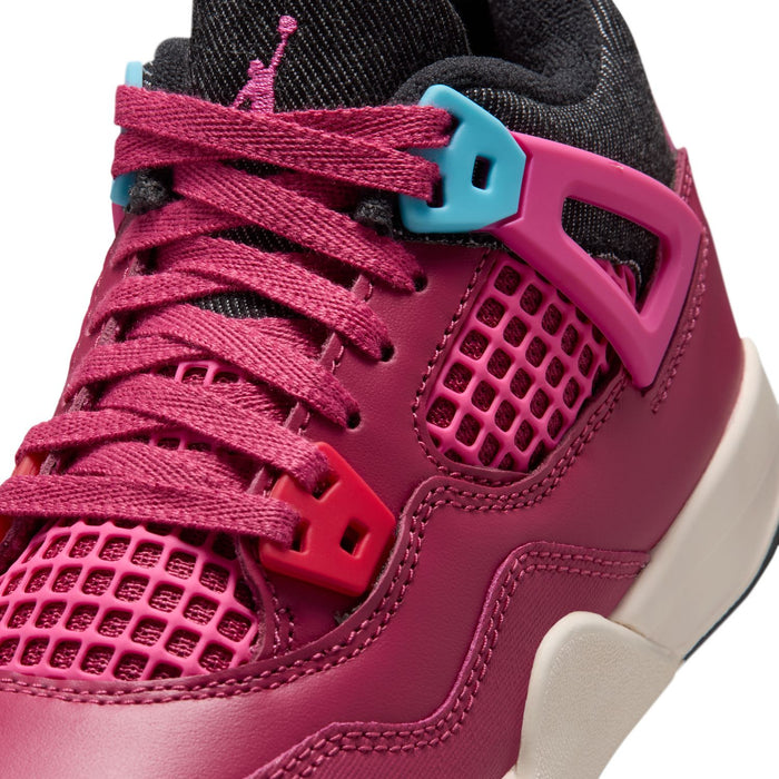 Close-up of kids' burgundy sneakers: pink laces, black collar, teal lace lock
