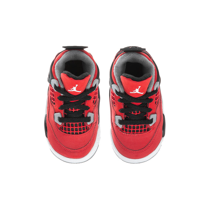 Toddler red low-top sneakers with black laces, grey lining, and tongue logo