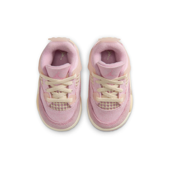 Toddler sneakers with pink padded tongue and cream laces, top view