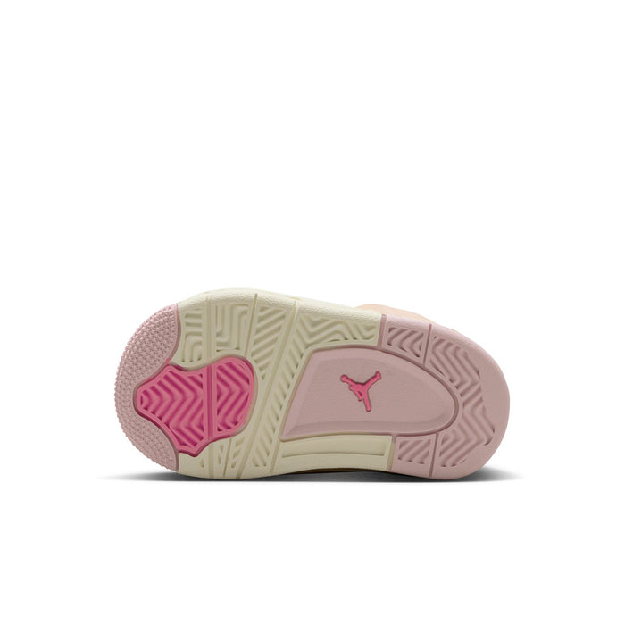 Toddler sneaker outsole view with pink traction pods and cream midsole