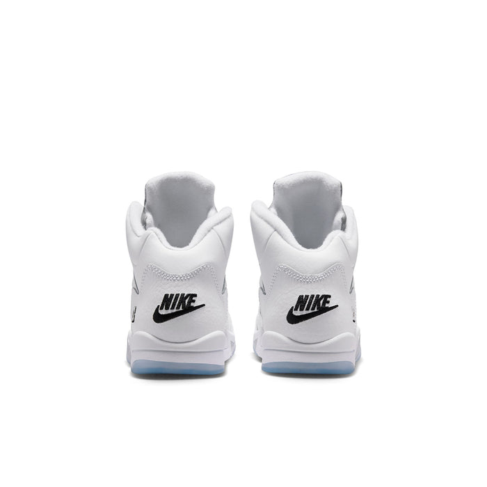 Kids white sneakers with black Nike heel logo and light blue sole