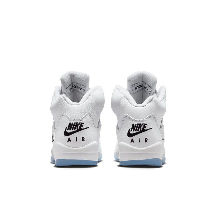 Youth white sneakers, rear view with Nike Air branding and light blue soles
