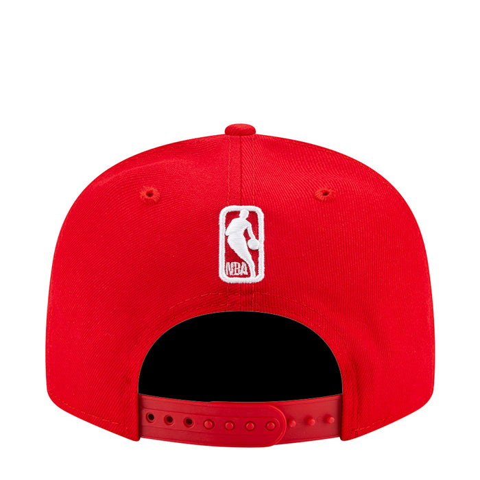 Red baseball cap with white embroidered back logo and black underbrim