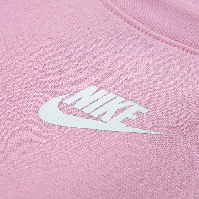 Light pink knit fabric with white Nike swoosh logo
