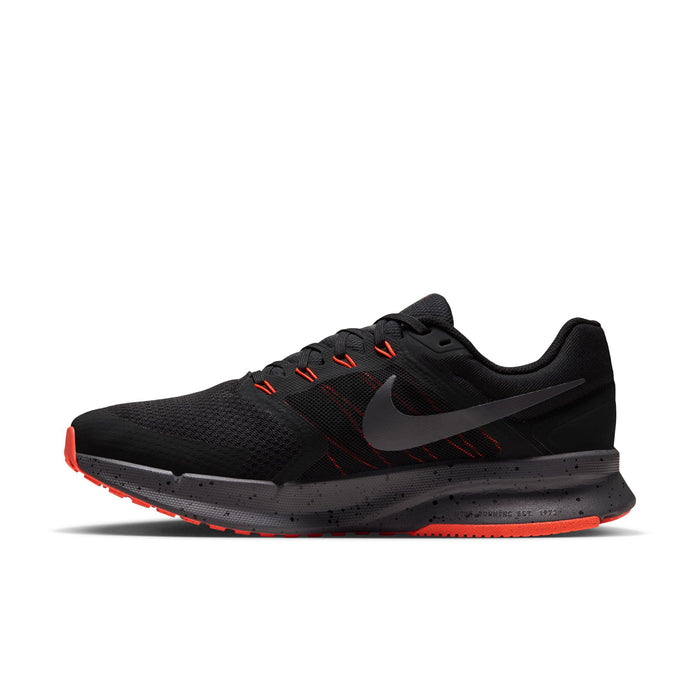 Men's black running shoe, side view with gray Swoosh and orange-red accents