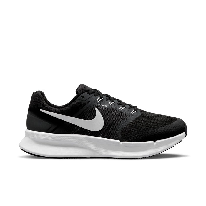 Black knit running shoe with white Nike swoosh, lace-up, and white midsole.