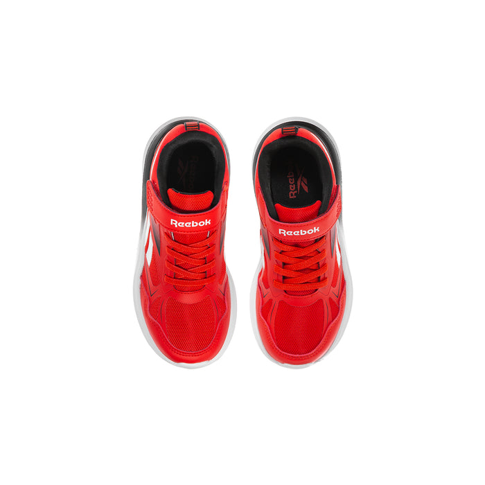 Kids red sneakers front view with white midsole and Reebok logo on inside tongue