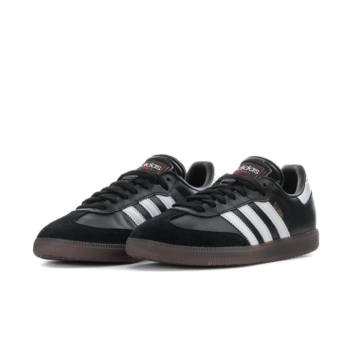 Men's black adidas Samba sneakers, side view with white three-stripe stripes