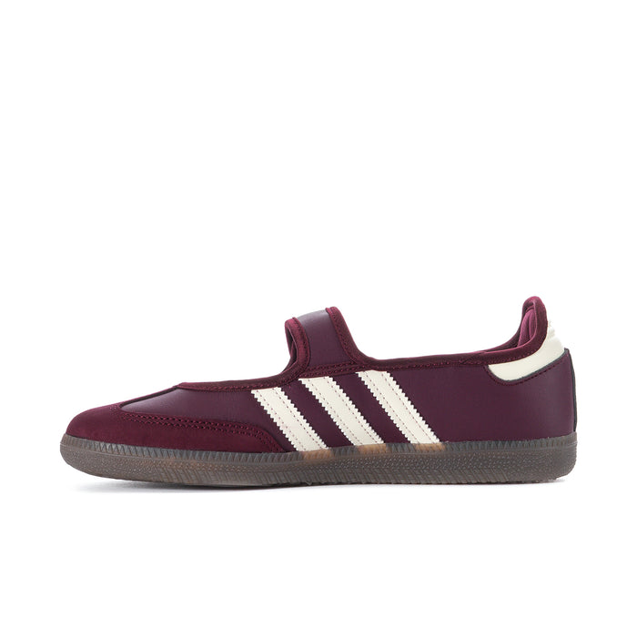 Women's maroon low-top sneaker with three cream side stripes and gold metallic trim