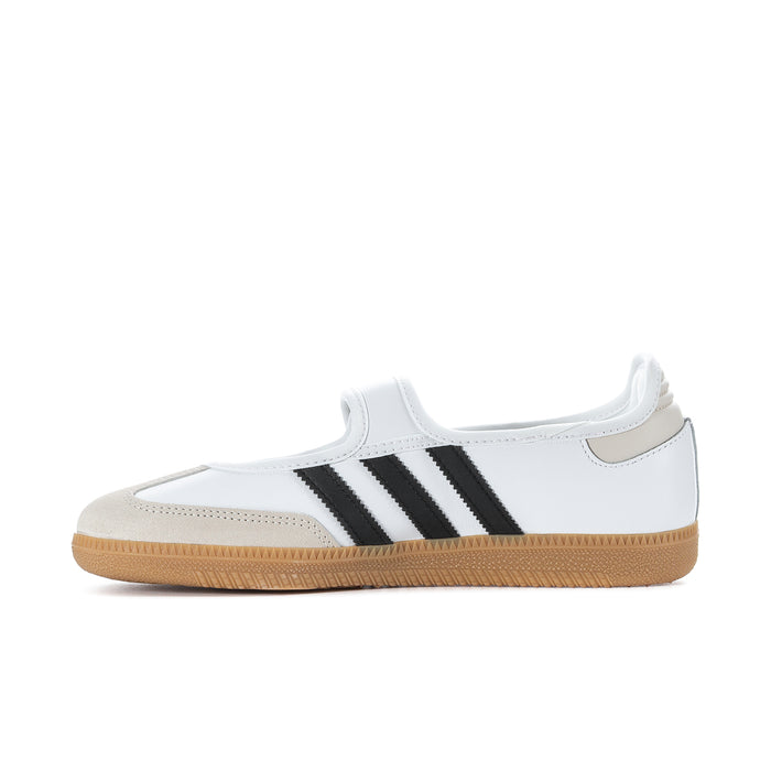 White adidas Samba Jane sneakers with bold black stripes and tan gum rubber sole